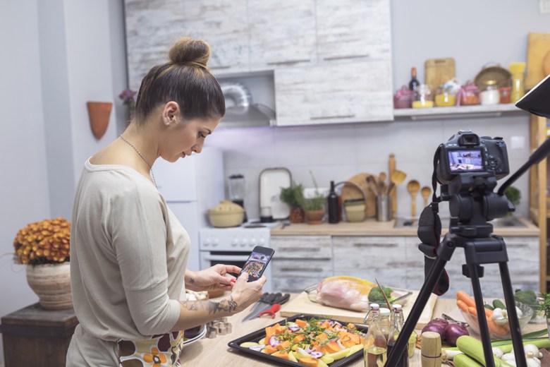 Woman enjoying cooking and vlogging