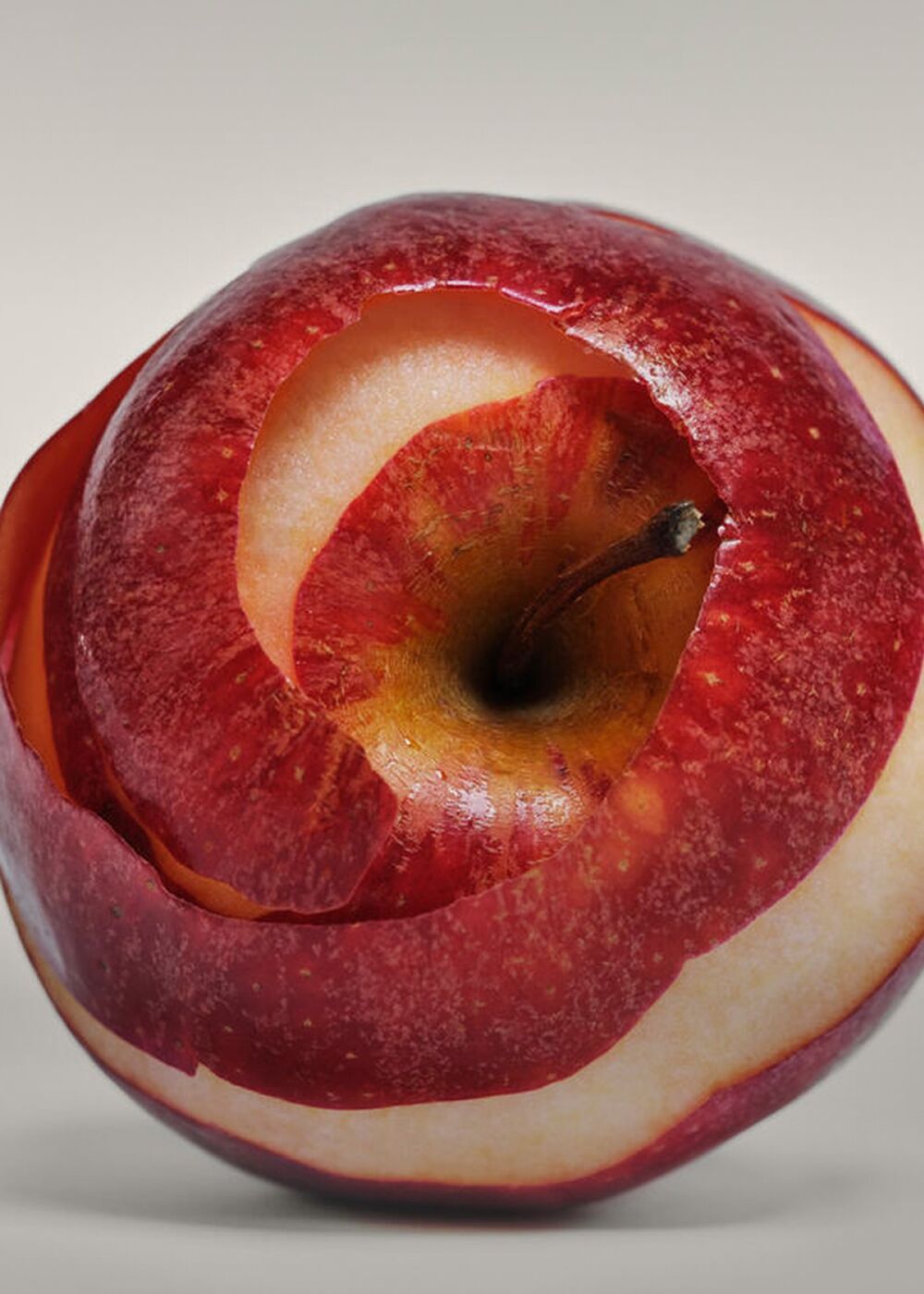 A peeled red apple