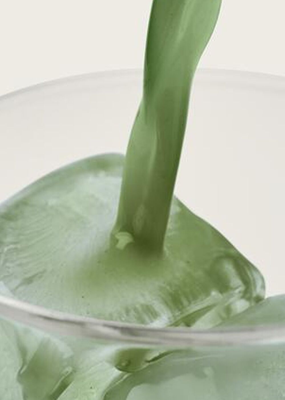 Mixed AG1 being poured into a glass