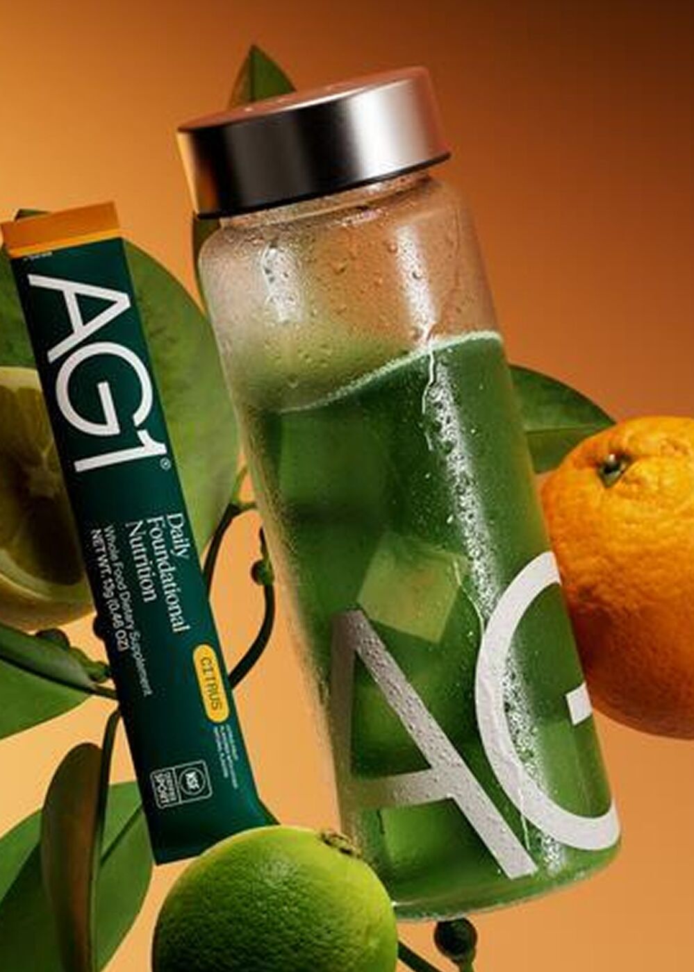 AG1 shaker and travel pack with citrus fruit