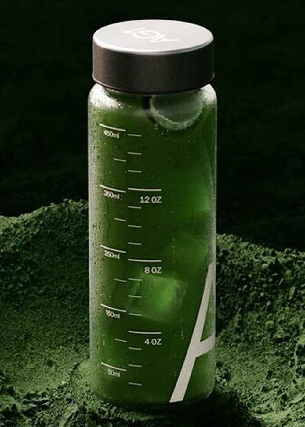 AG1 shaker bottle standing in green powder